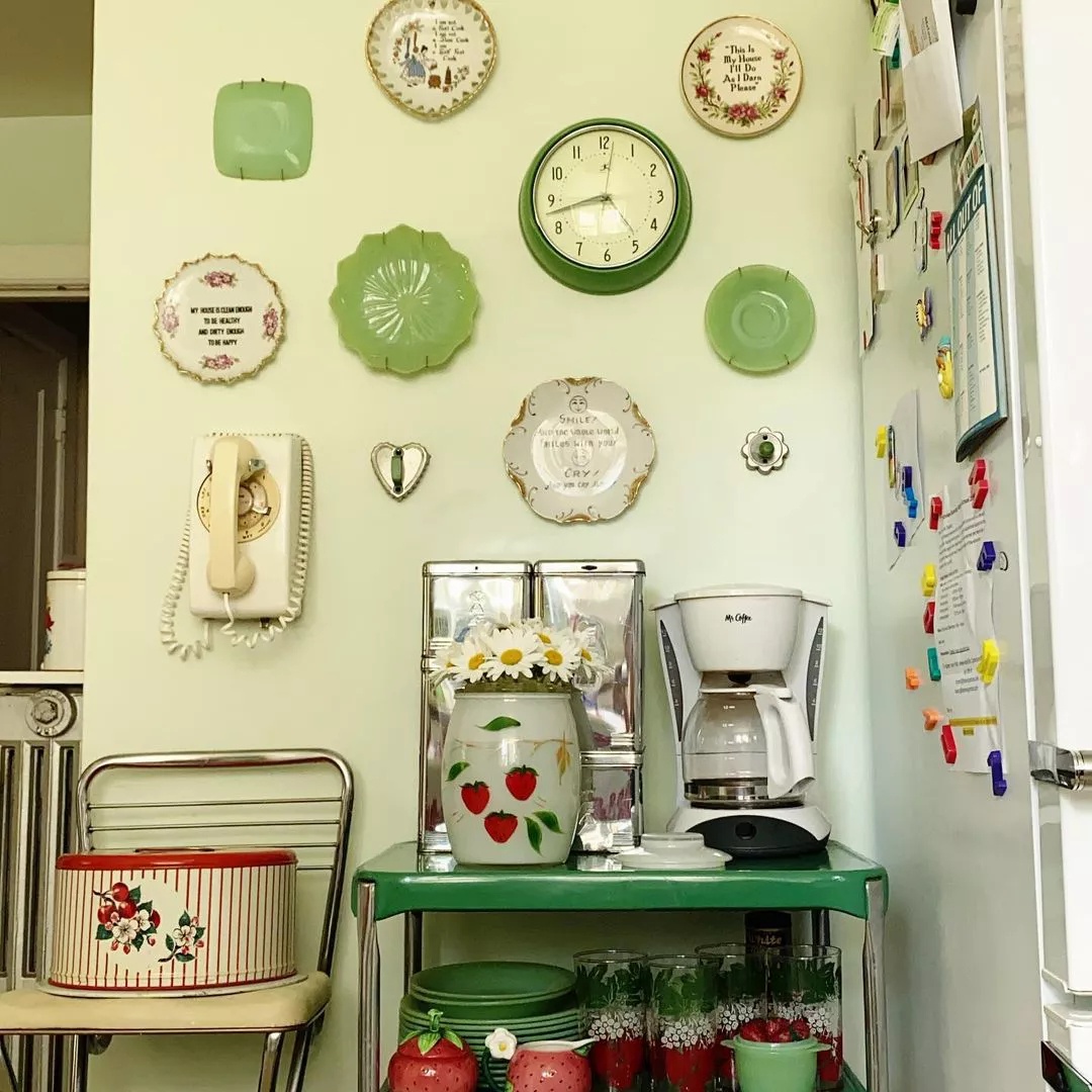 Thrifted plates displayed on kitchen wall