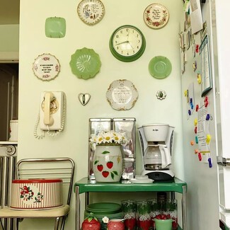 Thrifted plates displayed on kitchen wall