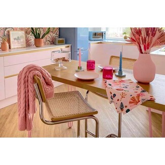 Versatile cane chairs in retro kitchen