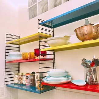 Vintage kitchen with blue shelves and decor