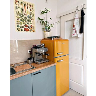 Warm marigold appliances in kitchen