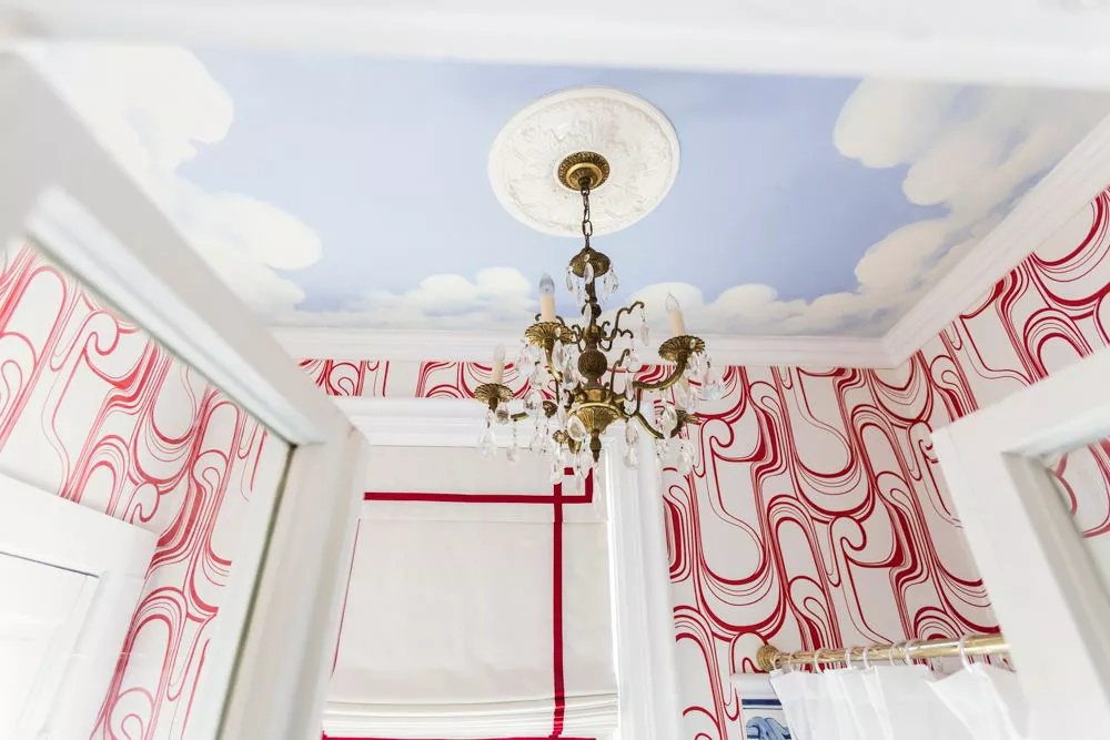 Bathroom with whimsical clouds on the ceiling