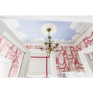 Bathroom with whimsical clouds on the ceiling
