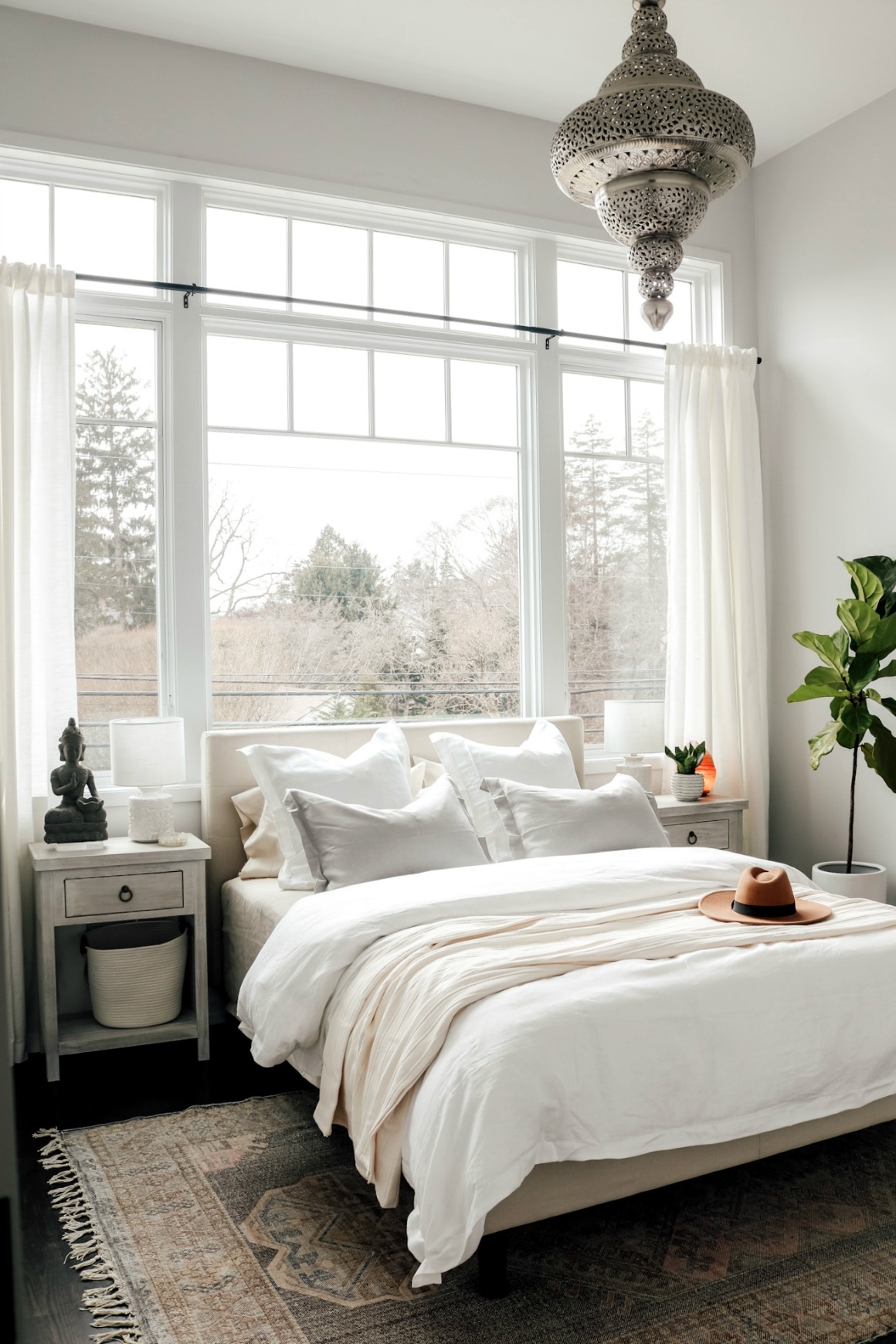 Boho Master Bedroom: Ornate Silver Pendant, Grid Windows