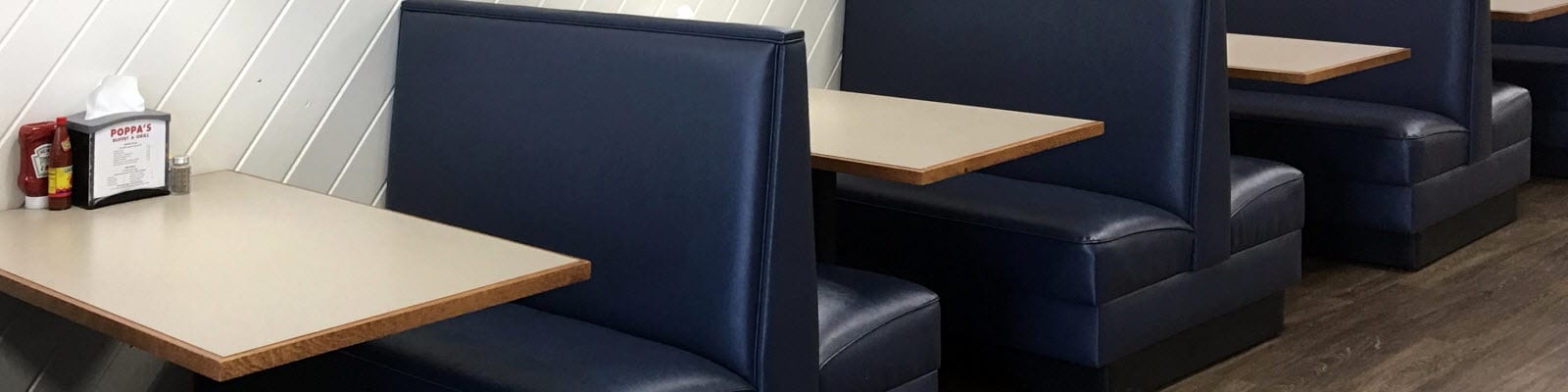 Booth Seating: Navy Blue Vinyl with Wood Edge Tables