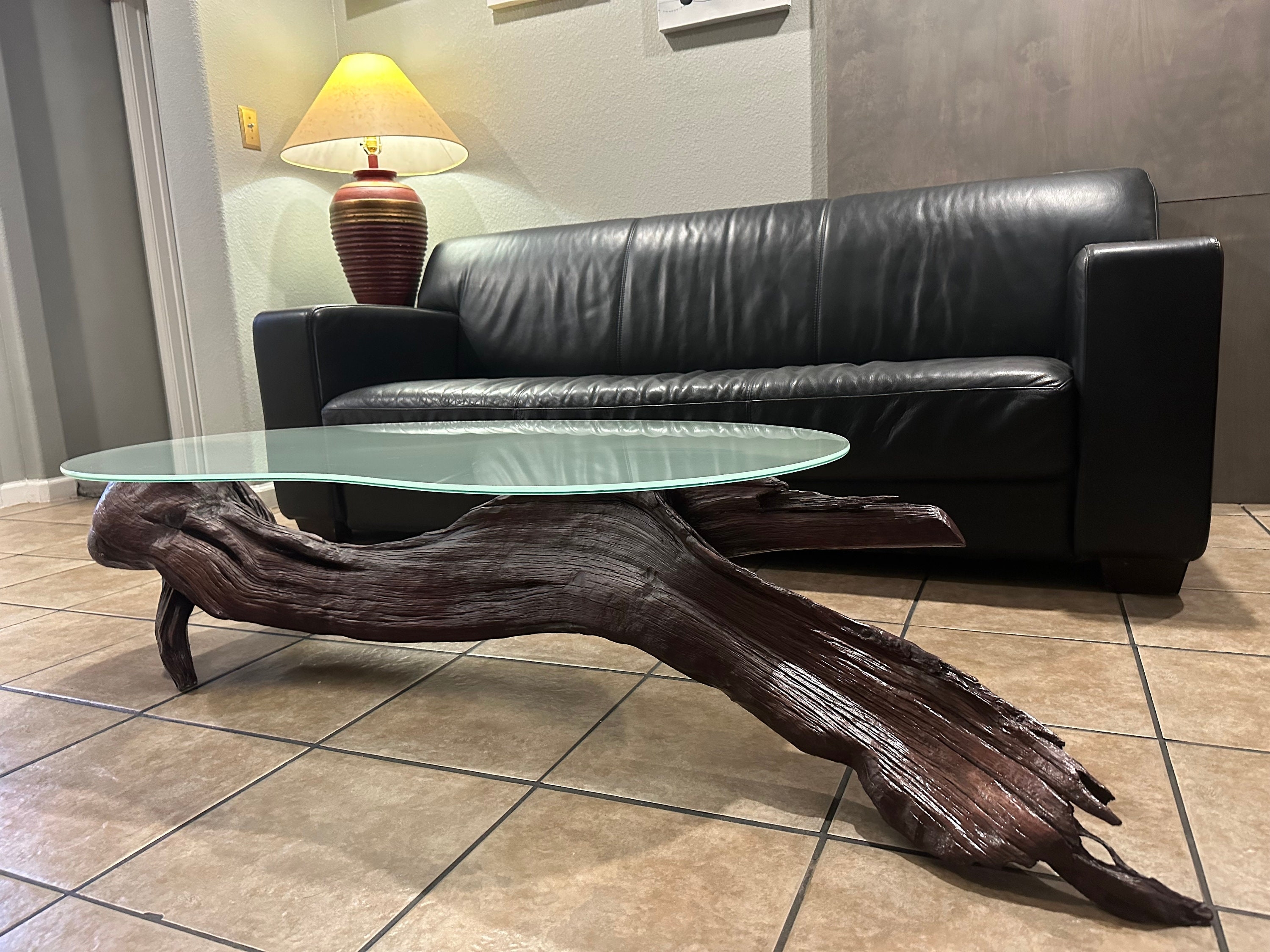 Coffee Table with Irregular Glass Top and Dark Wood Tones