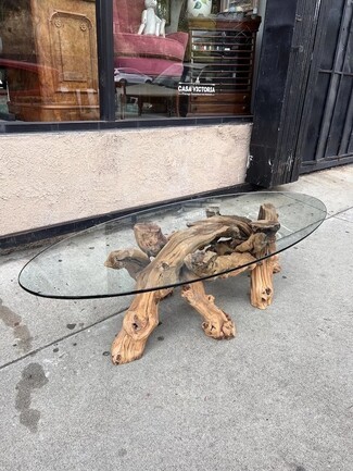 Coffee Table with Oval Glass Top and Gnarled Wood Branch Legs