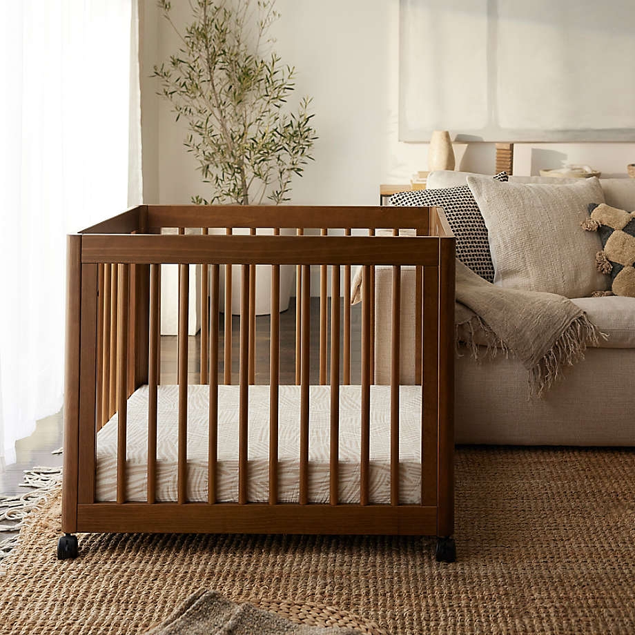 Convertible Crib Walnut Mobile Locking Casters - Compact crib with wheels