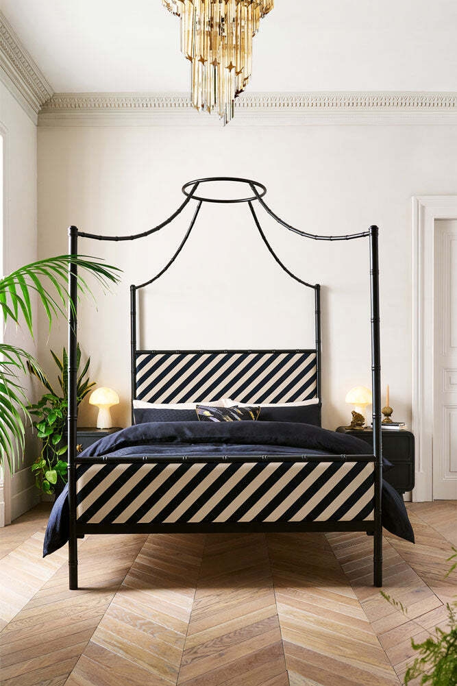Four Poster Bed accented with Bamboo Style Posts and Crown