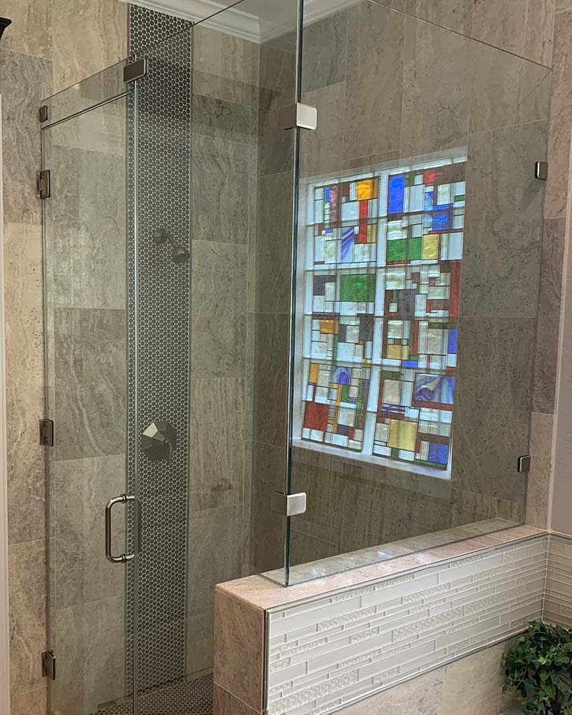 Frameless Glass Enclosure with Stained Glass and Penny Tiles