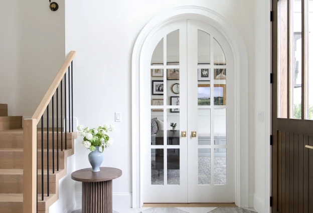 French Doors Arched Casing Brass Entryway Design