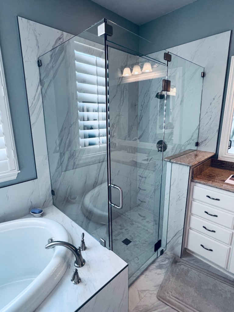Glass Shower Enclosure with Pony Wall Return and Marble Slabs
