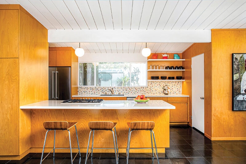 Kitchen Cabinetry with Honey Wood Tone Mosaic Backsplash