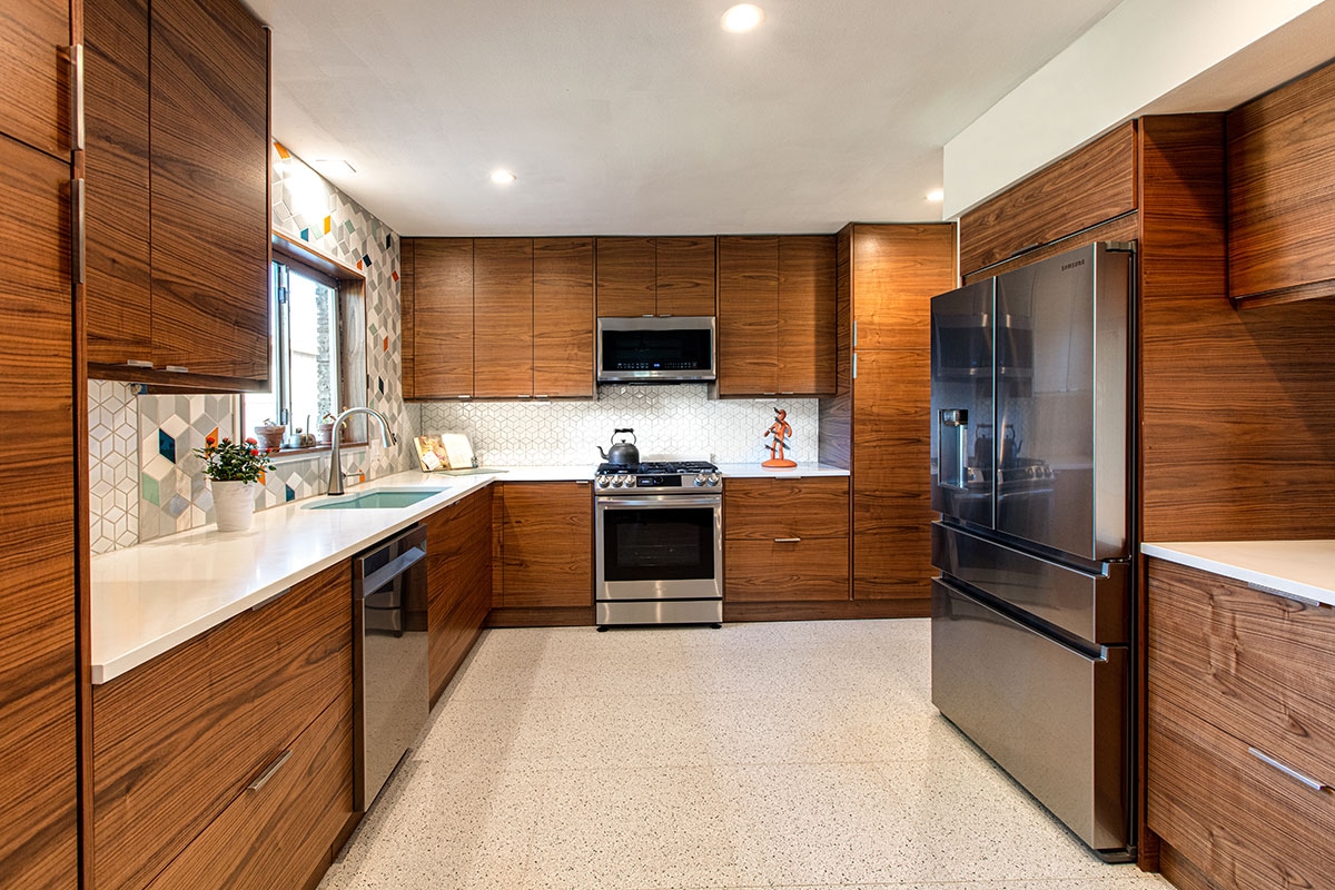 Kitchen Cabinets with Walnut Slab Doors and Terrazzo Floor