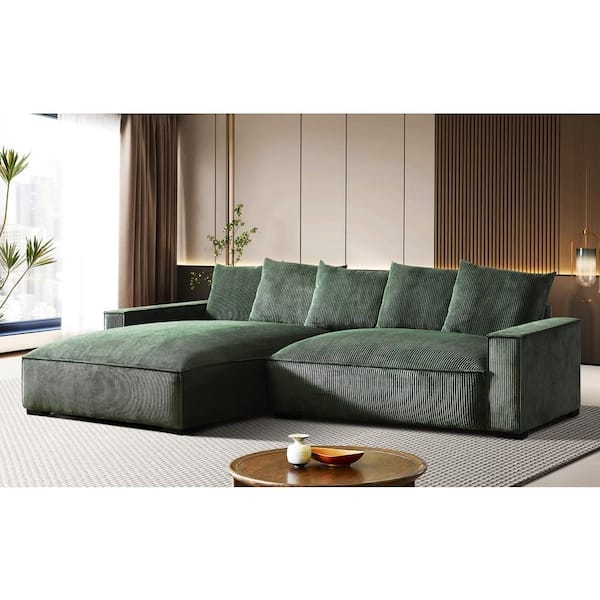L-shaped Sectional in dark green ribbed velvet texture