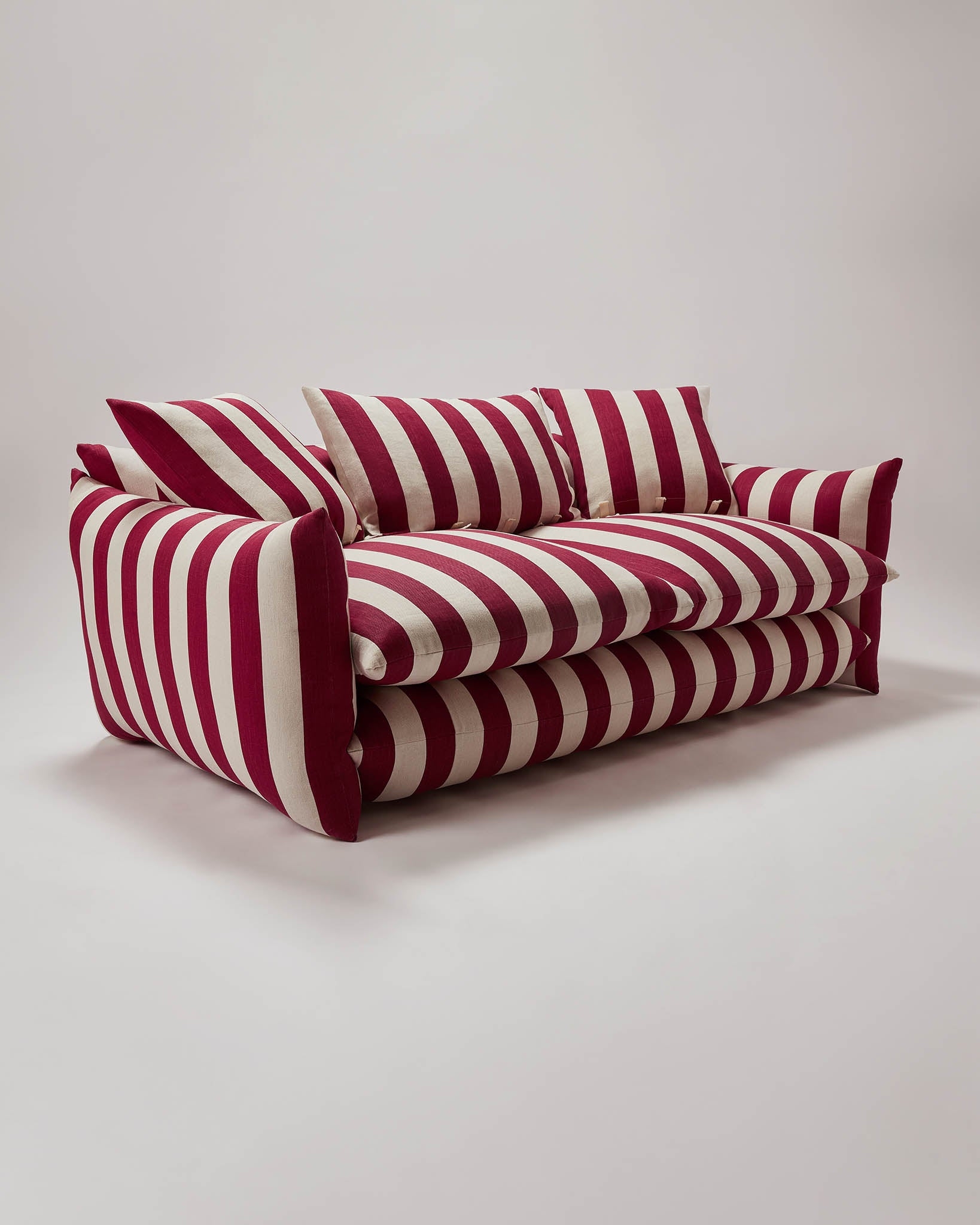 Low Slung Sofa With Double Stacked Cushions and Burgundy Stripes