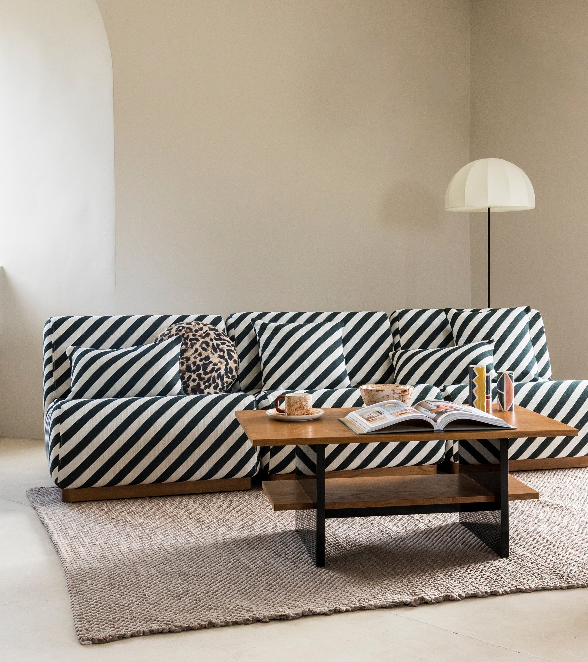 Modular Sofa With Diagonal Stripes and Wood Plinth Base