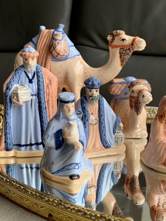Nativity Figurines with Mirrored Display Base and Soft Pastel Palette