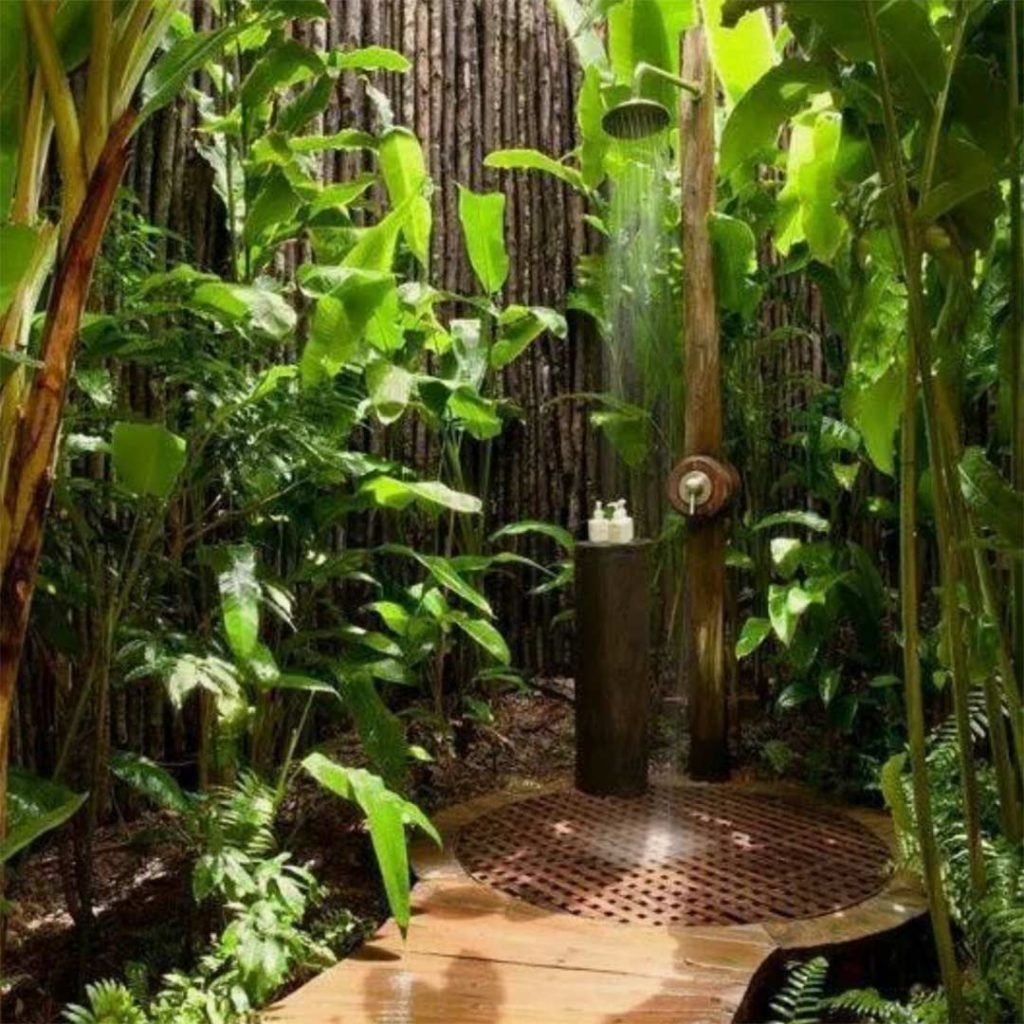 Outdoor Shower: Circular Grate Drain for Lush Garden Bathing