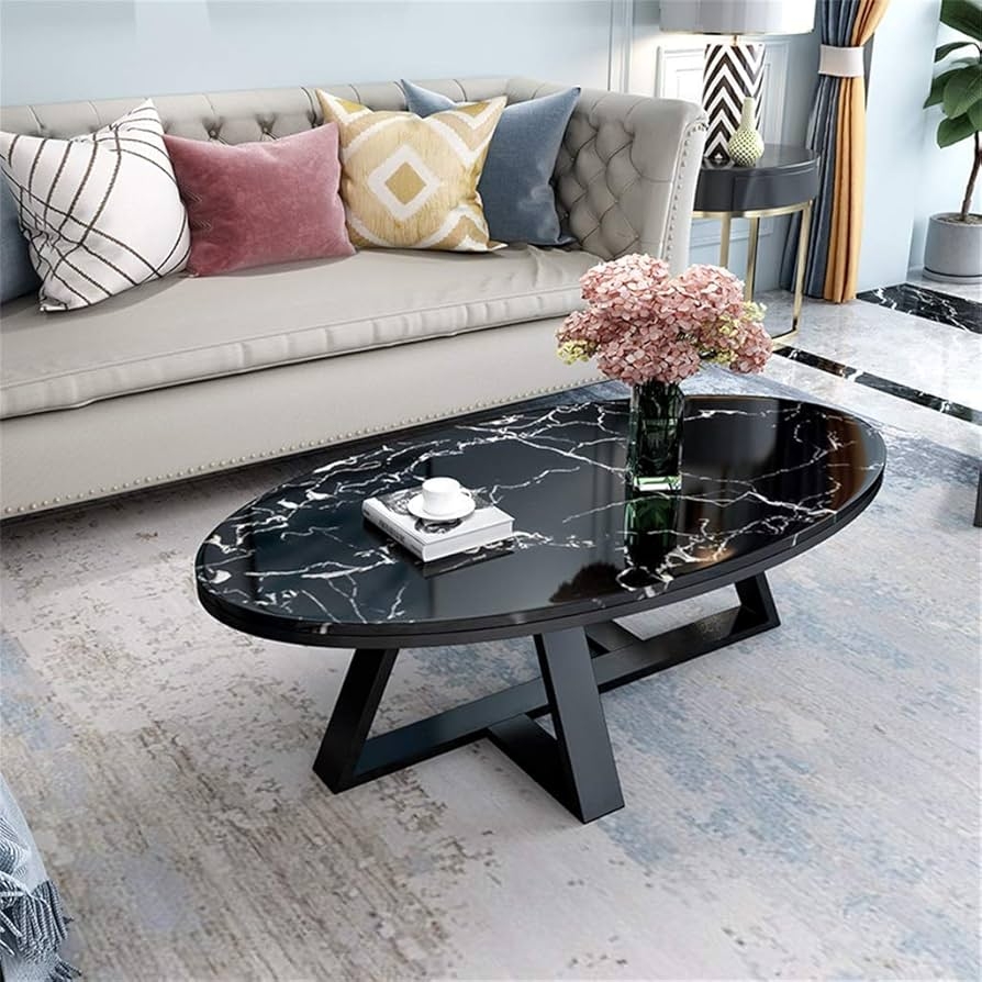 Oval Coffee Table featuring Black Geometric Base