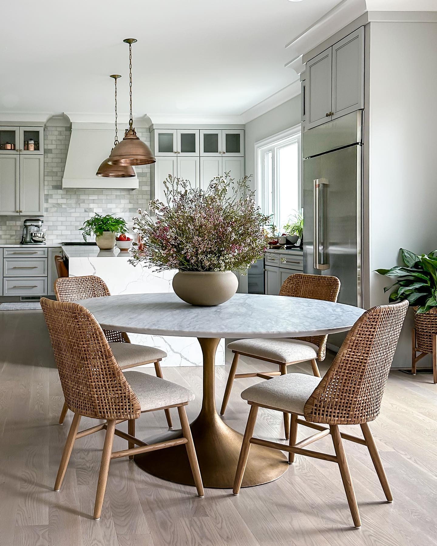 Oval Dining Table Brass Pedestal Woven Rattan Chairs Design