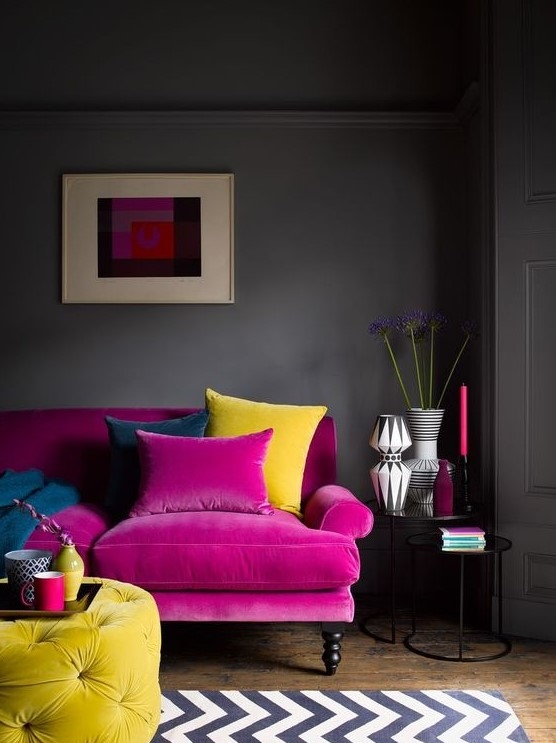 Pink Sofa with Yellow Tufted Pouf and Moody Charcoal Walls