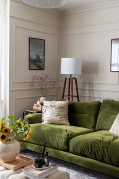 Plush Velvet Sofa Styled with Classic Wall Picture Molding