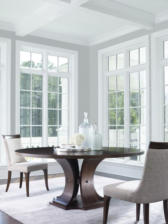 Round Dining Table 72 Inch Brunette Finish with Sculptural Curved Base.