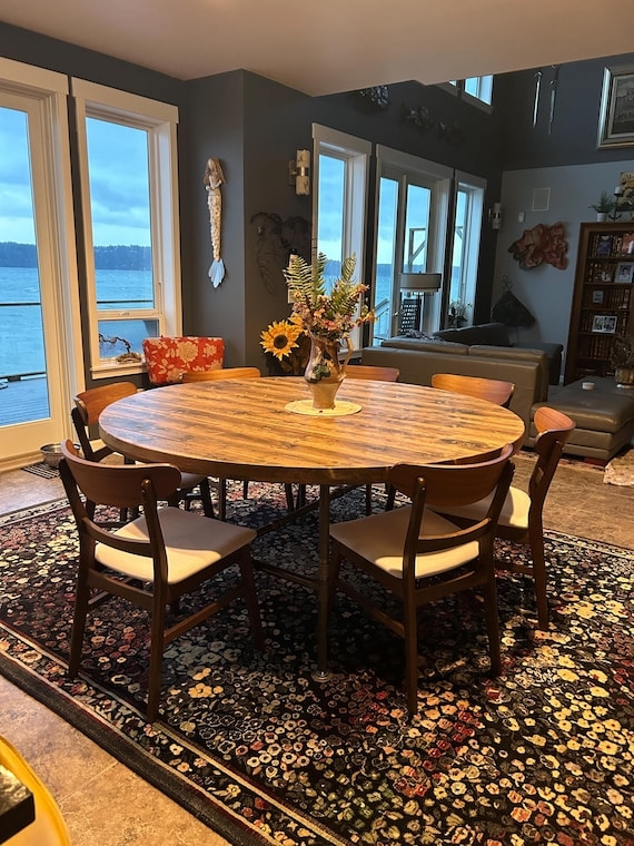 Round Dining Table 72 Inch Distressed Wood with Industrial Pipe Legs.