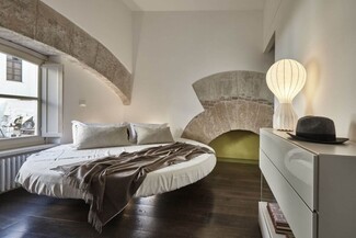 Round Floating Bed Warm Neutral Cantilevered Minimalist Architectural