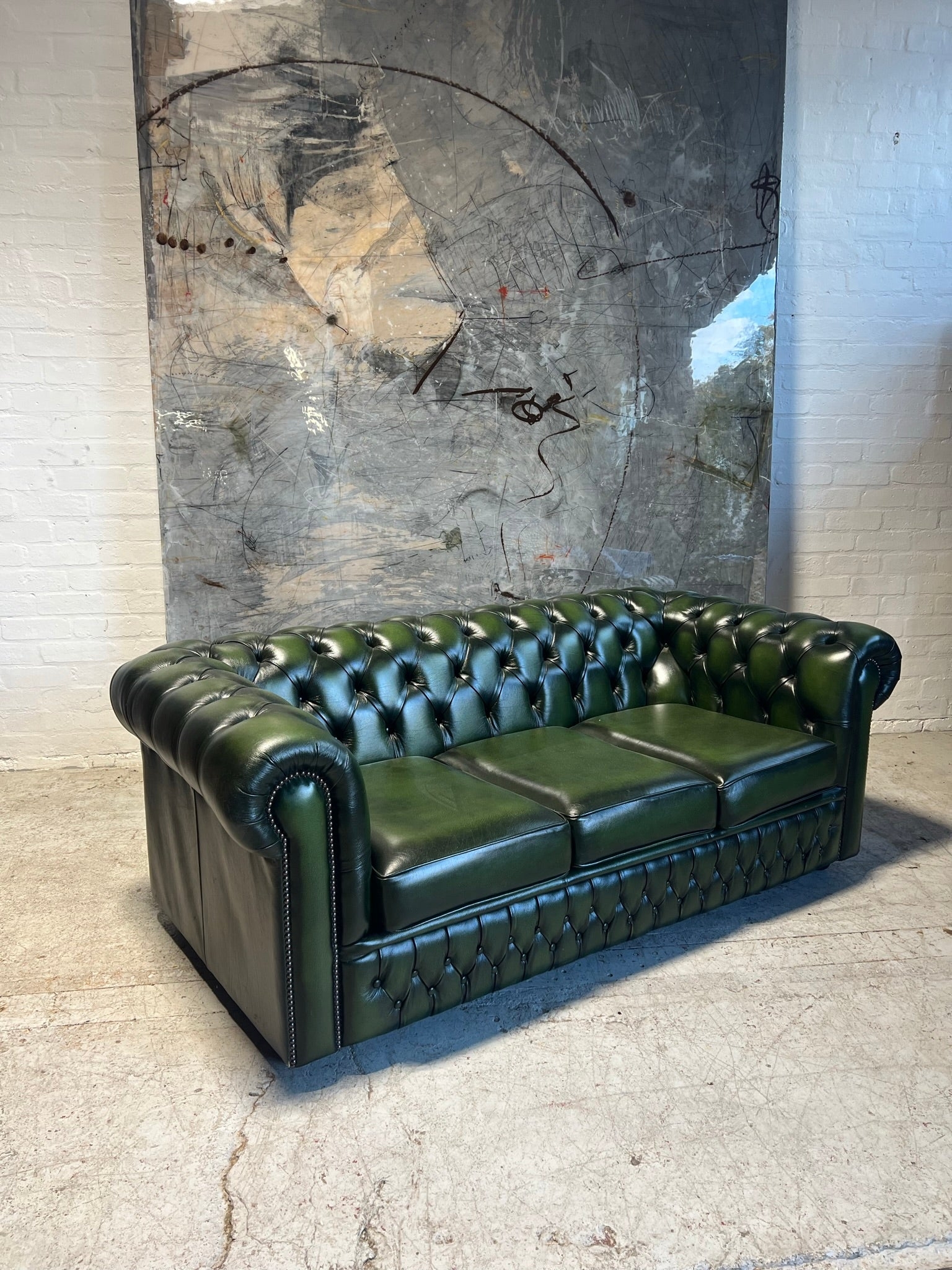 Semi-Gloss Antiqued Chesterfield Sofa with Unique Tufted Front Rail