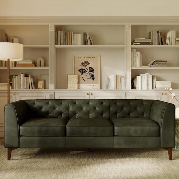 Sofa featuring olivine green leather and button tufting