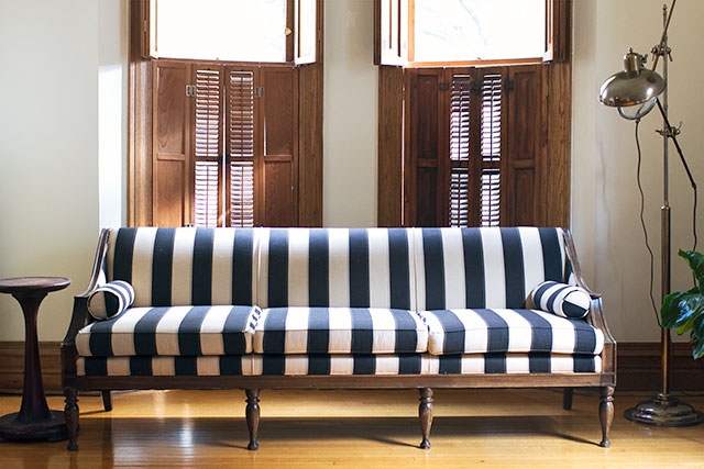 Sofa Featuring Six Leg Base and Vertical Black White Stripes