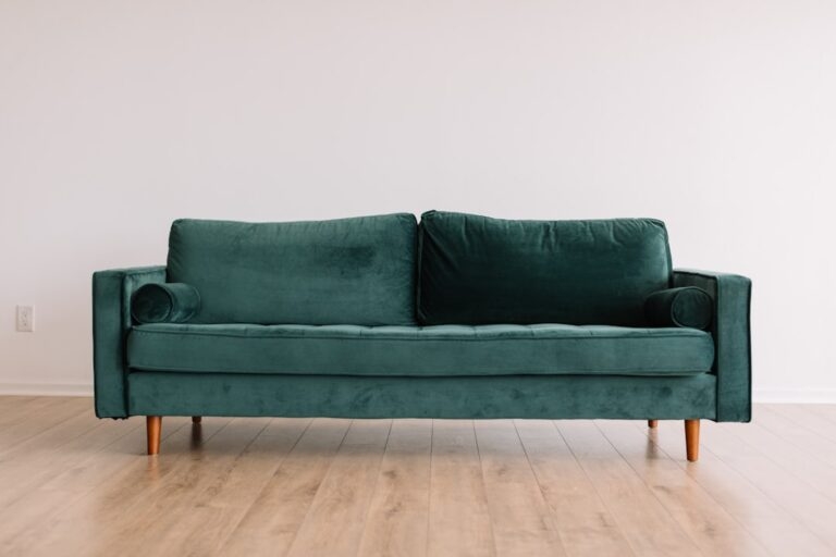 Upholstered Sofa: Emerald Green Velvet Bolster Couch