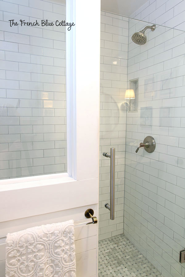 Walk-In Shower featuring Half Wall Window and Basketweave Floor