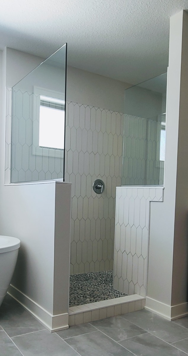 Walk-In Shower with Vertical Picket Wall and Pebble Floor