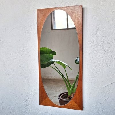 Wall Mirror: Oval Cutout Geometric Silhouette Teak Accent