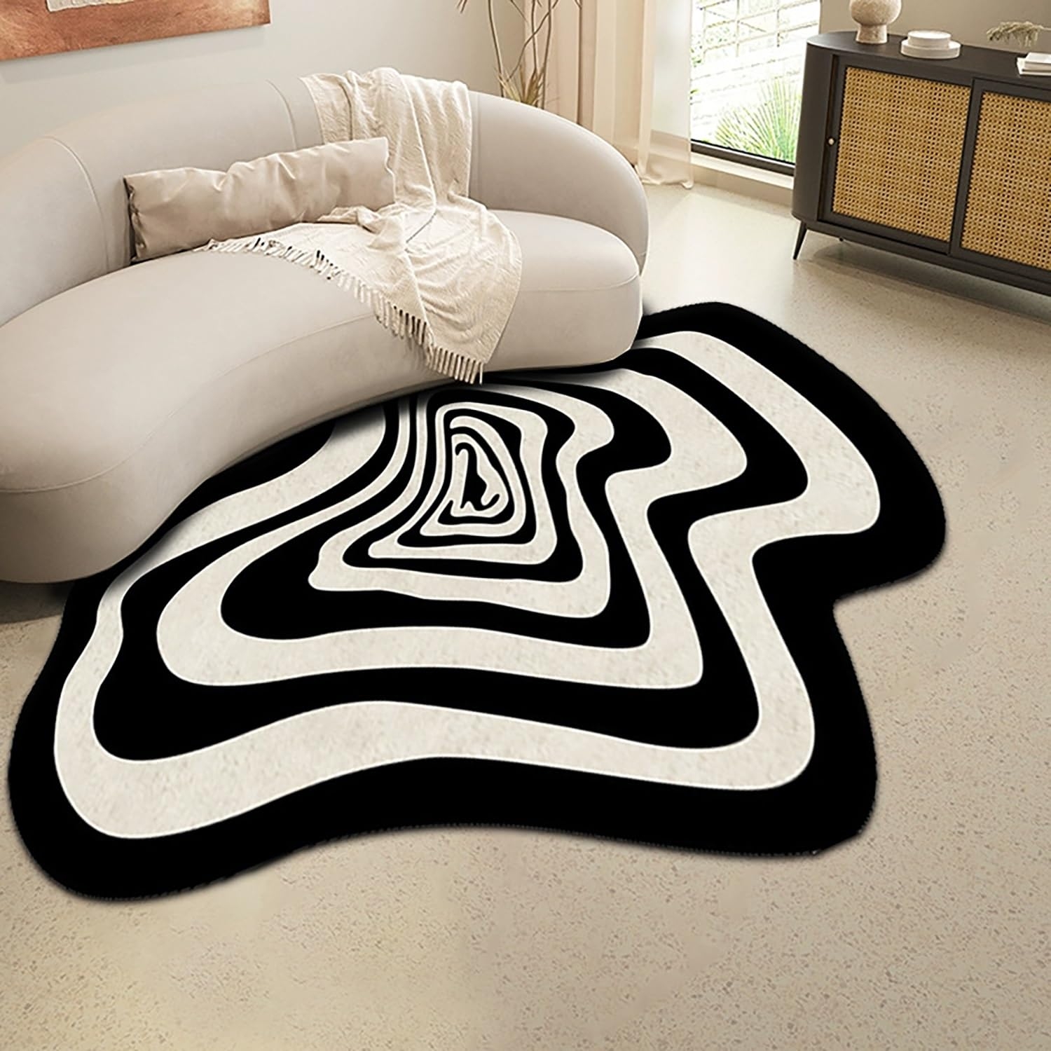 Wavy Edge Black and White Optical Rug with Concentric Pattern.