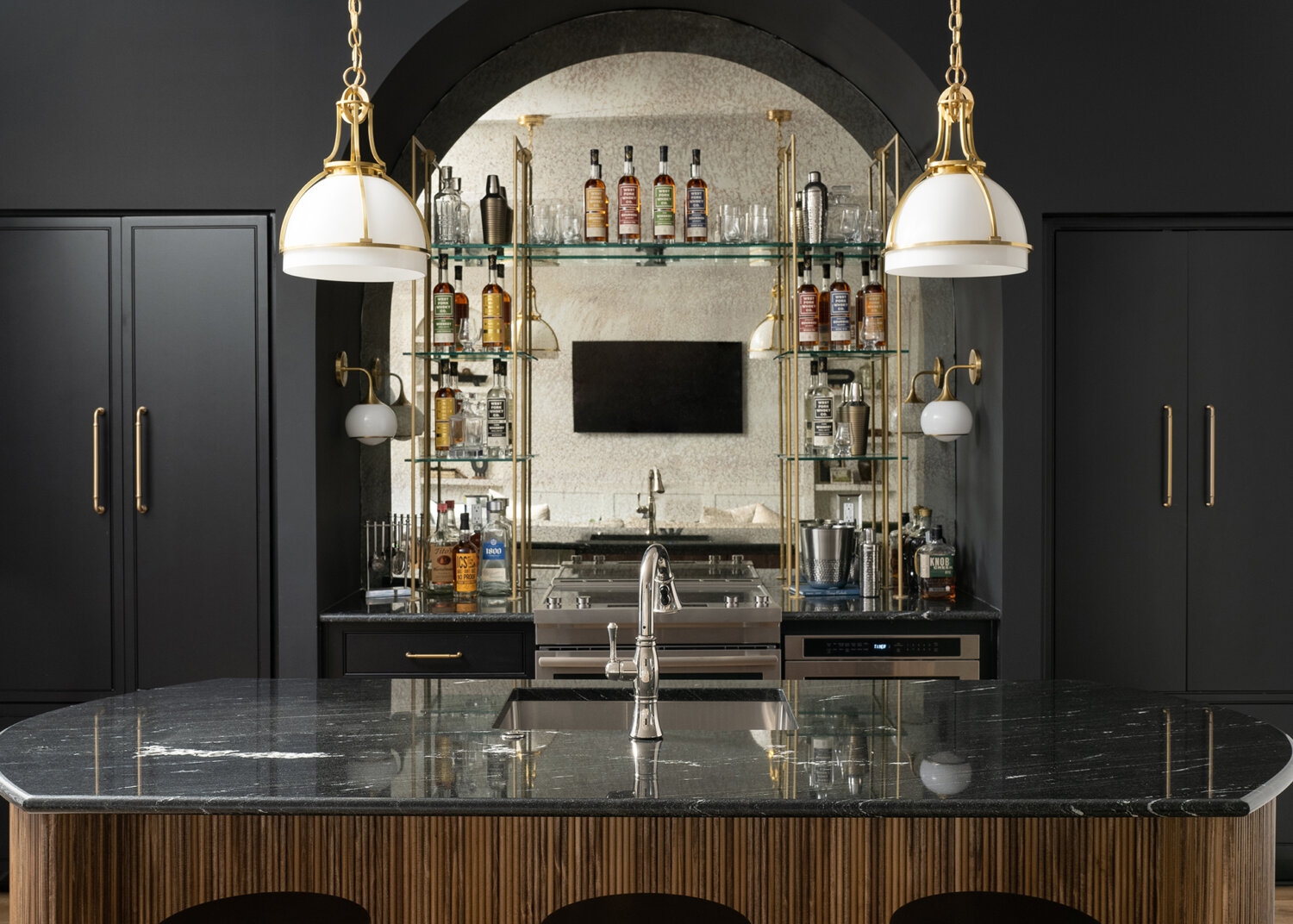 Wet Bar featuring Fluted Wood Island and Arched Mirrored Back