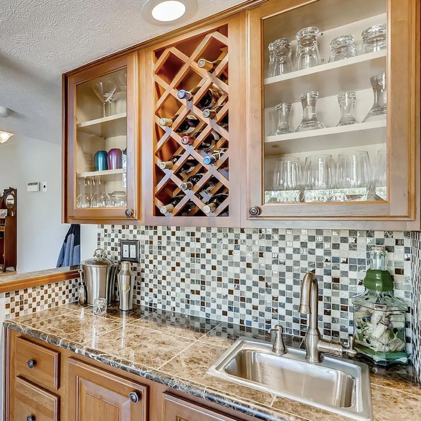 Wet Bar with Diagonal Wine Storage and Square Mosaic Tiles