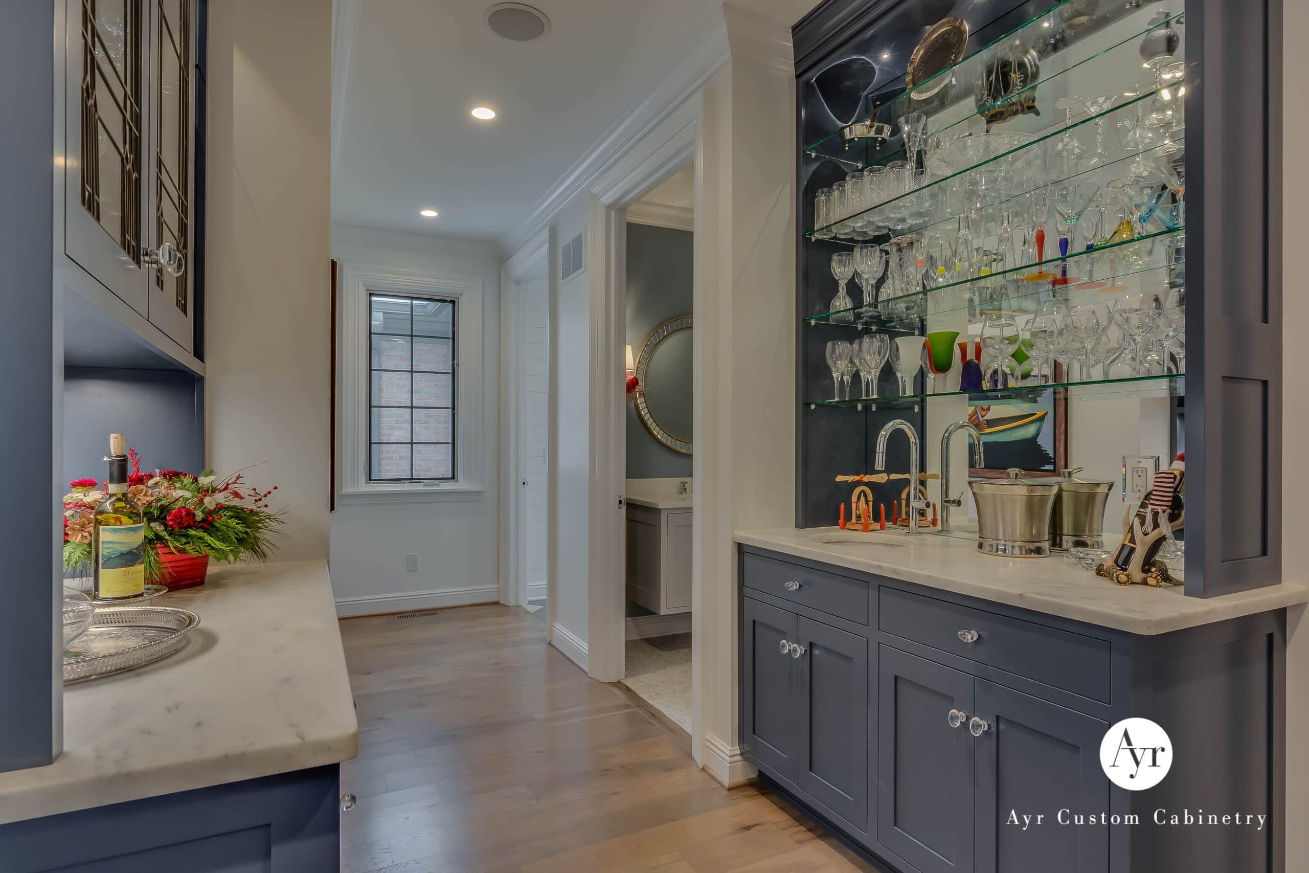 Wet Bar with Glass Shelving and Stone Like Countertop