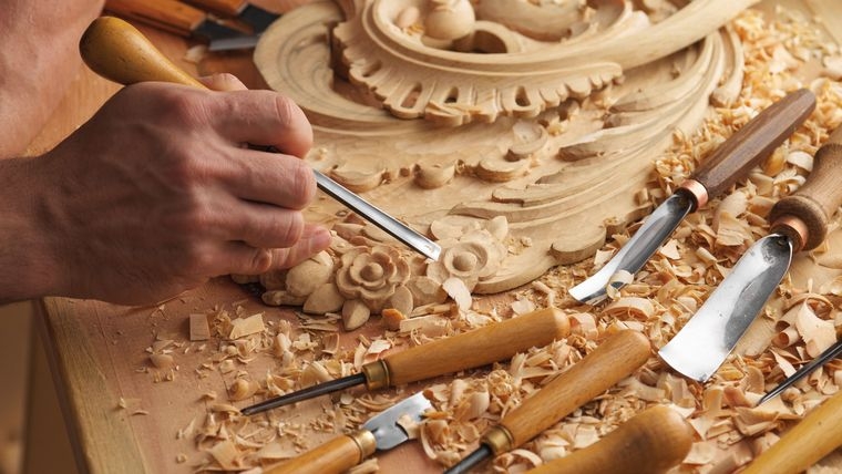 Wood Carving Decor with Artisan Tools and Floral Relief