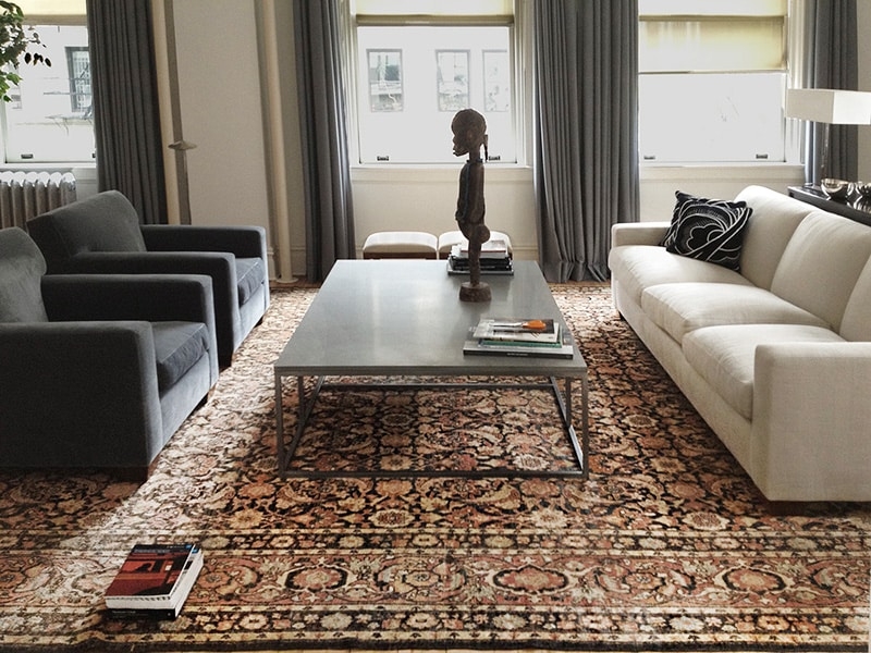 Area Rug with Persian Motif and Charcoal Armchair Styling