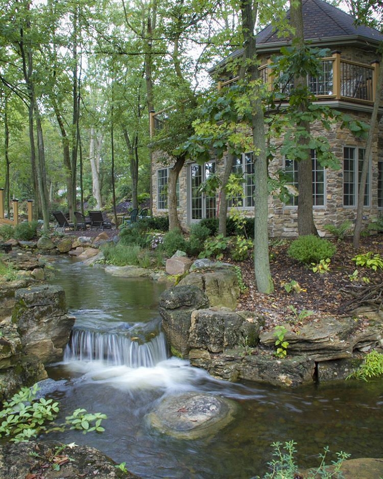Backyard Waterfall: Forested Backdrop Stone Clad Design