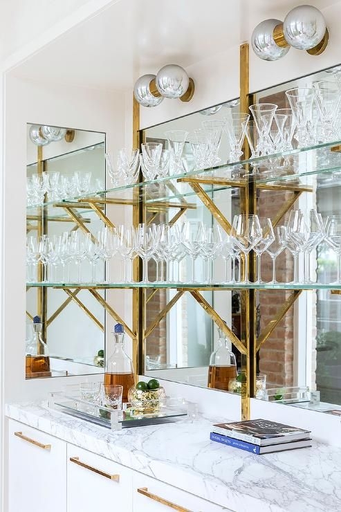 Bar Shelving with Y-Shaped Brass Brackets and Mirrored Bar Design