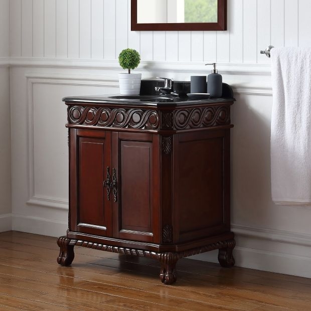 Bathroom Vanity: Dark cherry carved scrollwork with ornate wood doors