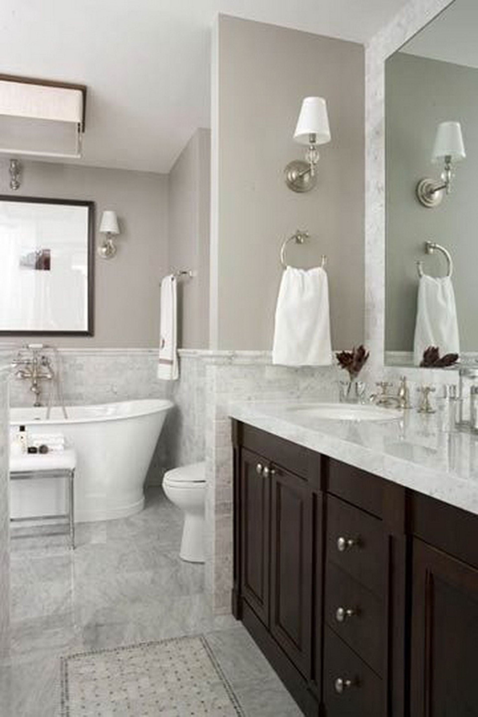 Bathroom Vanity: Espresso cabinetry marble veining high contrast design