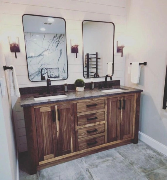 Bathroom Vanity: Walnut double sink with central drawers and shiplap