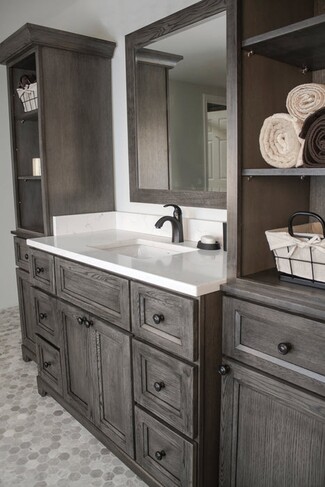 Bathroom Vanity With Charcoal Gray Wood And Open Storage Tower