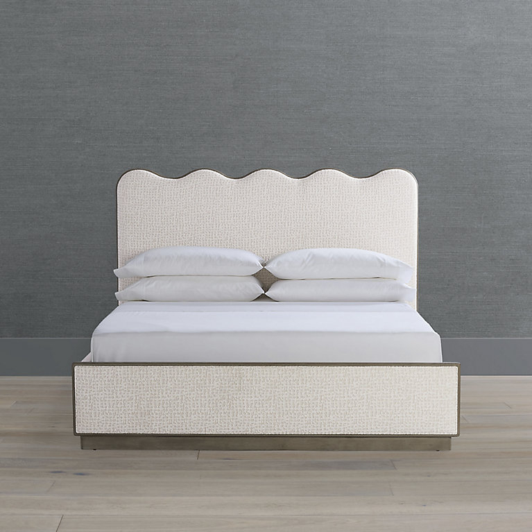 Bed Frame with Metallic Trim and Creamy Upholstered Bed